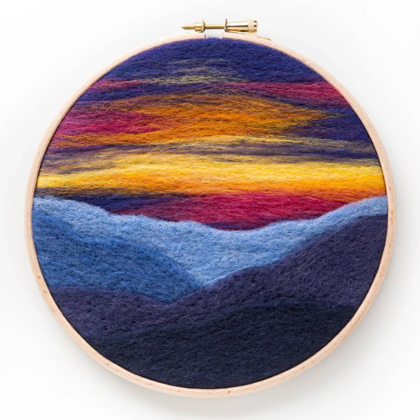 A Mountain Sunset Needle Felting Kit with a colorful sunset.